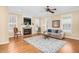 Inviting living room featuring a fireplace, hardwood floors, and a ceiling fan, creating a comfortable atmosphere at 88 Eltham, Rocky Mount, NC 27804