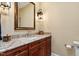Bathroom featuring custom cabinets, granite countertop, and sleek fixtures at 919 Woodham, Pittsboro, NC 27312