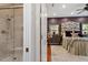 Bedroom with a shower and a stylishly decorated bed and dresser set at 919 Woodham, Pittsboro, NC 27312