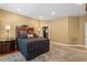 Bedroom with soft carpet, a large bed with decorative pillows, and natural lighting at 919 Woodham, Pittsboro, NC 27312