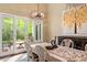This lovely dining room is bright and open, featuring a decorative chandelier and glass patio doors at 919 Woodham, Pittsboro, NC 27312