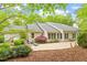 Backyard with beautiful patio area, lush greenery, and well maintained landscaping at 919 Woodham, Pittsboro, NC 27312