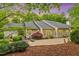 Backyard with beautiful patio area, lush greenery, and well maintained landscaping at 919 Woodham, Pittsboro, NC 27312