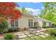 Attractive exterior with well-maintained patio and lush greenery at 919 Woodham, Pittsboro, NC 27312