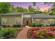 Charming home with meticulously landscaped front yard and brick pathway at 919 Woodham, Pittsboro, NC 27312