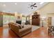 Open living room with vaulted ceilings, hardwood floors, a fireplace, and large windows at 919 Woodham, Pittsboro, NC 27312