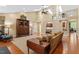 Spacious living room with hardwood floors, fireplace, and open access to the kitchen area at 919 Woodham, Pittsboro, NC 27312