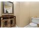 Elegant powder room featuring a decorative vanity and classic fixtures at 919 Woodham, Pittsboro, NC 27312