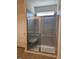 Modern bathroom with a glass-enclosed shower featuring a built-in seat at 95 Knoll Way, Sanford, NC 27332