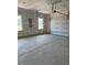 Spacious two-car garage with windows for natural light and an automatic garage door at 95 Knoll Way, Sanford, NC 27332