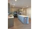 Spacious kitchen featuring stainless steel appliances, an island, and bright lighting at 95 Knoll Way, Sanford, NC 27332