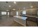 Modern kitchen with an island, stainless steel appliances, gray cabinets, subway tile backsplash, and ample natural light at 95 Knoll Way, Sanford, NC 27332