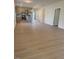 Open-concept living room boasts new light-colored flooring and a combined kitchen and dining space at 95 Knoll Way, Sanford, NC 27332