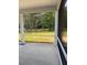 Screened patio with a tranquil view of the wooded backyard, great for relaxing at 95 Knoll Way, Sanford, NC 27332