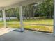Spacious screened patio offers a peaceful view of the lush green backyard at 95 Knoll Way, Sanford, NC 27332
