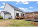 Exterior view of the backyard featuring a deck and outdoor pergola at 956 The Parks Dr, Pittsboro, NC 27312