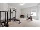 A bright exercise room, featuring work out equipment at 956 The Parks Dr, Pittsboro, NC 27312
