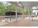 Screened in porch with vaulted ceiling, wooden floors and a view of the backyard at 956 The Parks Dr, Pittsboro, NC 27312