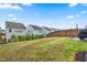 Level, grassy backyard area featuring privacy fence and neatly arranged landscaping for relaxing outdoor enjoyment at 1018 Sweet Cream Ct, Durham, NC 27703