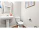 Bathroom with a modern sink, toilet, and framed mirror, offering a clean and functional space at 1018 Sweet Cream Ct, Durham, NC 27703