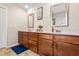 Bathroom with double sink vanity, framed mirrors, and generous counter space for an organized and stylish area at 1018 Sweet Cream Ct, Durham, NC 27703