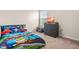 bedroom with a colorful bed, playful decor, and a TV on a drawer offering a fun space at 1018 Sweet Cream Ct, Durham, NC 27703