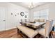 Cozy dining room featuring a modern table set and elegant chandelier at 1018 Sweet Cream Ct, Durham, NC 27703