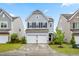 Charming two-story home with a two-car garage, landscaped yard, and welcoming front porch at 1018 Sweet Cream Ct, Durham, NC 27703