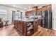 Well-equipped kitchen with a center island, stainless steel appliances, and ample cabinet space at 1018 Sweet Cream Ct, Durham, NC 27703