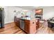 Modern kitchen island with stainless steel appliances, hardwood floors, and an open layout at 1018 Sweet Cream Ct, Durham, NC 27703