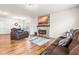 Spacious living room featuring a fireplace, open layout, and comfortable seating area at 1018 Sweet Cream Ct, Durham, NC 27703