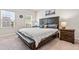 Spacious bedroom featuring a bed, stylish decor, neutral carpet and abundant natural light at 1018 Sweet Cream Ct, Durham, NC 27703