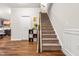 Inviting stairway with carpeted steps, wooden handrail, and decorative accents at 1018 Sweet Cream Ct, Durham, NC 27703