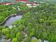 Location aerial view highlighting the home's proximity to a lake and local amenities at 102 Windrock Lane, Cary, NC 27518