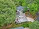 Home aerial view highlighting a spacious lot and privacy provided by mature trees at 102 Windrock Lane, Cary, NC 27518