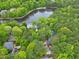 Aerial view of a home in a community with a scenic lake at 102 Windrock Lane, Cary, NC 27518