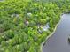 Lakefront home in a wooded community offering scenic views and privacy, ideal for tranquil living at 102 Windrock Lane, Cary, NC 27518