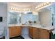 Large bathroom with dual sinks, vanity, and expansive mirrors with vanity lighting and a skylight at 102 Windrock Lane, Cary, NC 27518