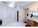 Spacious bathroom with skylight features a vanity, toilet, and a bathtub with shower at 102 Windrock Lane, Cary, NC 27518