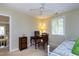 Bedroom featuring a daybed, desk, ceiling fan, and view of the second story below at 102 Windrock Lane, Cary, NC 27518