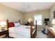Bedroom features wood bedframe, ceiling fan, window, and an exercise machine at 102 Windrock Lane, Cary, NC 27518