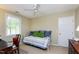 Bedroom with a daybed, desk, ceiling fan, and a window that provides natural light at 102 Windrock Lane, Cary, NC 27518