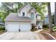 Lovely two-story home with a two-car garage and well-maintained lawn at 102 Windrock Lane, Cary, NC 27518