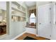 Elegant foyer featuring a window seat and custom shelving at 102 Windrock Lane, Cary, NC 27518