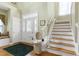 Bright foyer with staircase and entry way at 102 Windrock Lane, Cary, NC 27518
