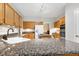 Well-equipped kitchen with granite counters, stainless steel appliances, and ample wood cabinetry at 102 Windrock Lane, Cary, NC 27518