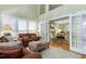Spacious living area featuring hardwood floors and a seamless transition to other living spaces at 102 Windrock Lane, Cary, NC 27518