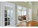 Elegant living room with hardwood floors and French doors, offering a bright and open space at 102 Windrock Lane, Cary, NC 27518