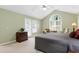 Spacious main bedroom with vaulted ceilings and French doors to balcony at 102 Windrock Lane, Cary, NC 27518