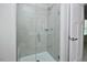 Walk-in shower features tile surround and a glass door at 1020 Kentlands Dr, Durham, NC 27713